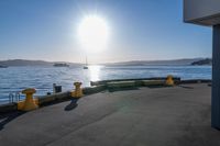 the sun shines brightly over the ocean on a sunny day at a marina in san francisco, california