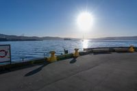 the sun shines brightly over the ocean on a sunny day at a marina in san francisco, california