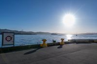 the sun shines brightly over the ocean on a sunny day at a marina in san francisco, california