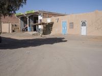 A Sunny Day in a Moroccan Village: Houses on the Sand Streets