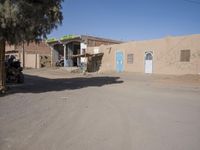 A Sunny Day in a Moroccan Village: Houses on the Sand Streets