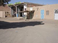 A Sunny Day in a Moroccan Village: Houses on the Sand Streets