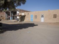 A Sunny Day in a Moroccan Village: Houses on the Sand Streets