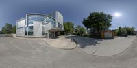 a panorama of a view of a building through the lens, on a sunny day