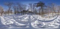 there is a large mound of snow in the woods with snowmobiles all around