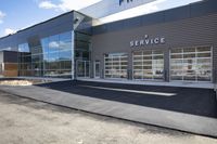 an image of a service station in the daytime light on a sunny day with a building in the background