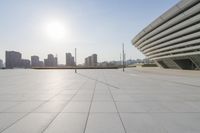 a paved courtyard overlooking the buildings of the city on a sunny day in asia or india