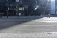 a man riding a bike past buildings on the side of the road in front of a fire hydrant