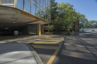 the yellow and gray markings are painted on a parking lot in an apartment building on a sunny day