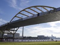 a bridge is opened up to allow an open area for walking and cycling on the side of the river