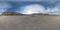 there is a photo taken looking at the landscape in this fisheye lens image, from a 360 - angle