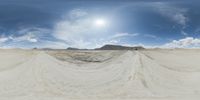 there is a photo taken looking at the landscape in this fisheye lens image, from a 360 - angle