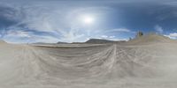 there is a photo taken looking at the landscape in this fisheye lens image, from a 360 - angle