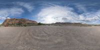 there is a photo taken looking at the landscape in this fisheye lens image, from a 360 - angle