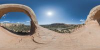 there is a photo taken looking at the landscape in this fisheye lens image, from a 360 - angle