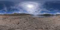 there is a photo taken looking at the landscape in this fisheye lens image, from a 360 - angle