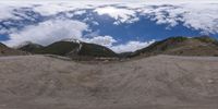 there is a photo taken looking at the landscape in this fisheye lens image, from a 360 - angle