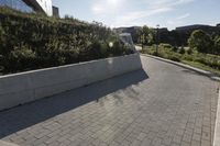 a view of an outside area of an office building with large windows and a circular driveway