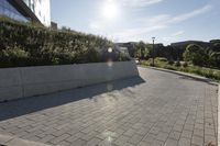 a view of an outside area of an office building with large windows and a circular driveway