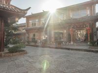 the sun shines brightly on a sunny day in a chinese courtyard or patio area