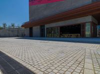 a very large building with a little street in front of it that looks like a museum