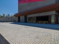 a very large building with a little street in front of it that looks like a museum