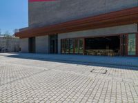 a very large building with a little street in front of it that looks like a museum