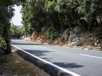 Sunny Road Through Spain's Lush Landscape