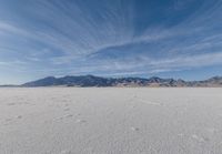 this vast salt flat looks like an incredible place to live in the desert, in the daytime