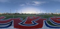 the field is decorated with red and blue on it as well as other colored sports surfaces