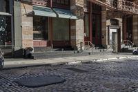 a street scene with old buildings and bicycles parked on the sidewalk, on a sunny day