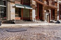a street scene with old buildings and bicycles parked on the sidewalk, on a sunny day