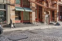 a street scene with old buildings and bicycles parked on the sidewalk, on a sunny day