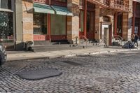 a street scene with old buildings and bicycles parked on the sidewalk, on a sunny day