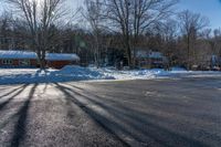 this is a street with lots of snow on it as seen in the sun from behind