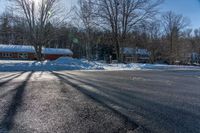 this is a street with lots of snow on it as seen in the sun from behind