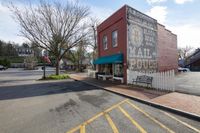 the store has a sign advertising milk, which appears to be an empty street, and it's on display on the corner