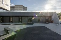 a view of an outside area of an office building with large windows and a circular driveway