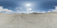 an image of a desert with a sun behind it that's very bright as he can see in this one