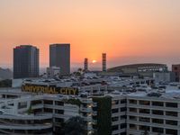 view from a building at sunrise over the city with a sign that says universal city