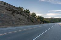 Sunrise on a Rural Road with Mountain View and Tree