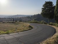 Sunrise in Tuscany Countryside: A View of Asphalt Road