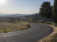 Sunrise in Tuscany Countryside: A View of Asphalt Road