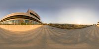 the time - lapse photo shows the exterior of a building as the sun sets