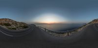 this is an image of an amazing sunset above the ocean with no waves on it