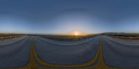 an image of a road at sunset taken with the fish - eye lens on camera