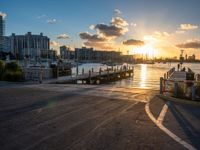 a pier with boats on water during sunset time in the cityscape area of florida