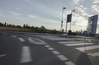 an image of the sun going down in the city as seen from a car traveling on a highway