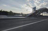 an image of the sun going down in the city as seen from a car traveling on a highway