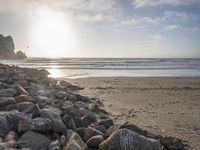 this is an image of a person riding a surfboard on a beach near the ocean